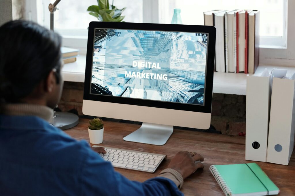 A person working on digital marketing freelance at a well-organized workspace with a computer.